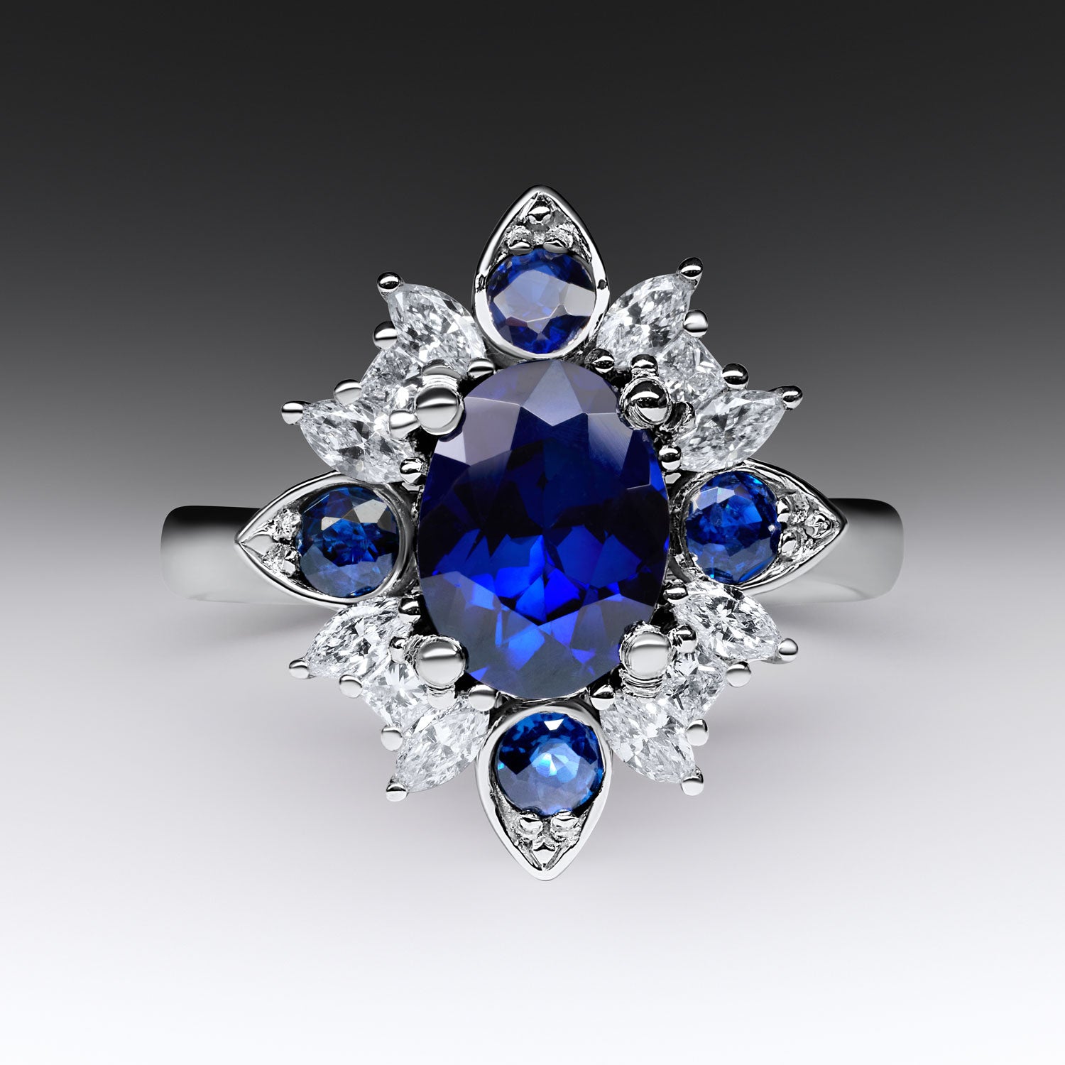 Faith Jewels Emzo ring with recut blue sapphires and white diamonds in a North Star-inspired design