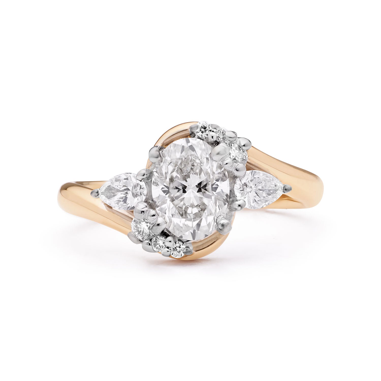 Faith Jewels Boomerang diamond engagement ring featuring an oval-cut diamond surrounded by floating pear-cut diamonds and brilliant-cut diamonds, set in an 18k yellow gold band