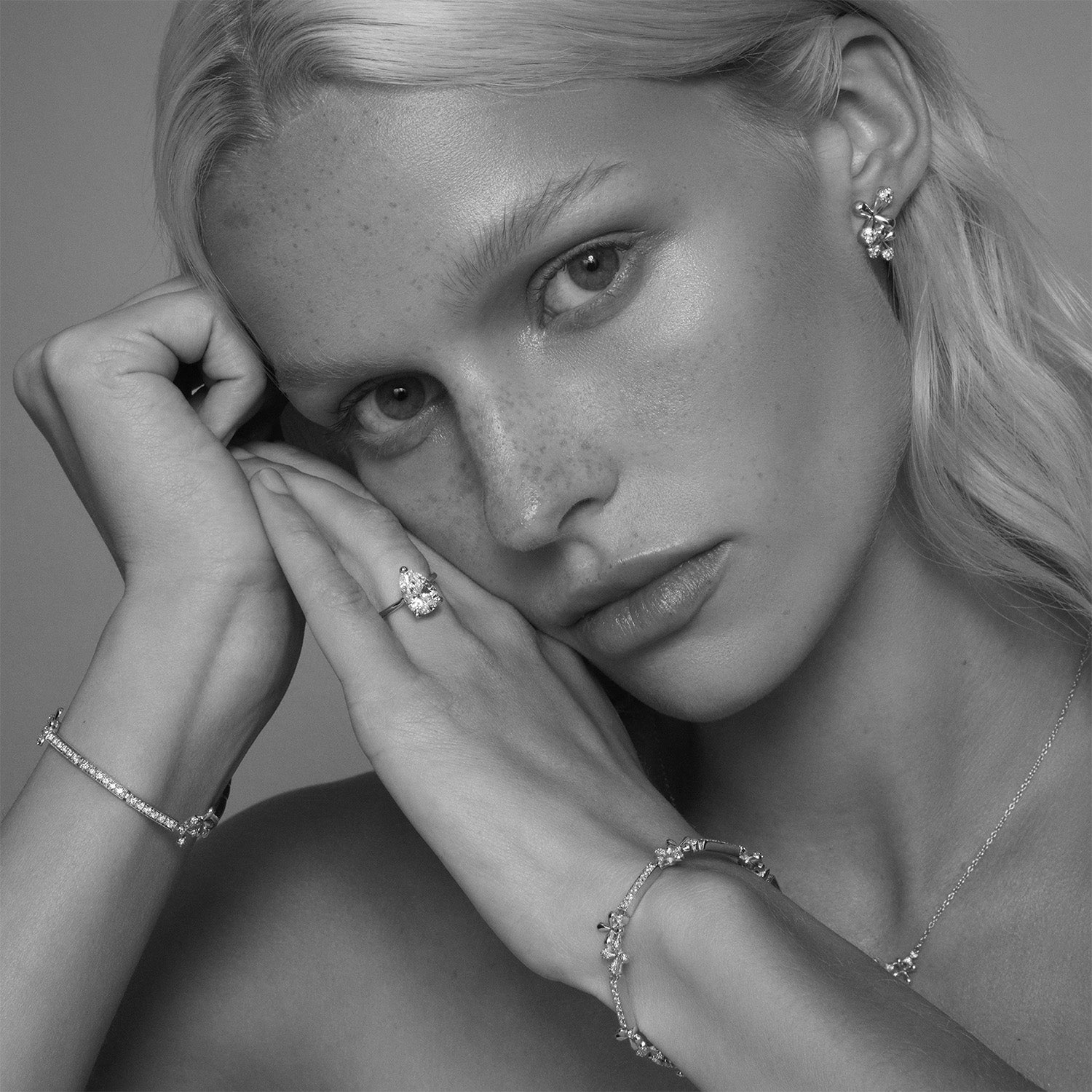 Faith Jewels Bridget Engagement Ring featuring a pear-shaped diamond held by a three-prong setting, elegantly set on a polished yellow gold band