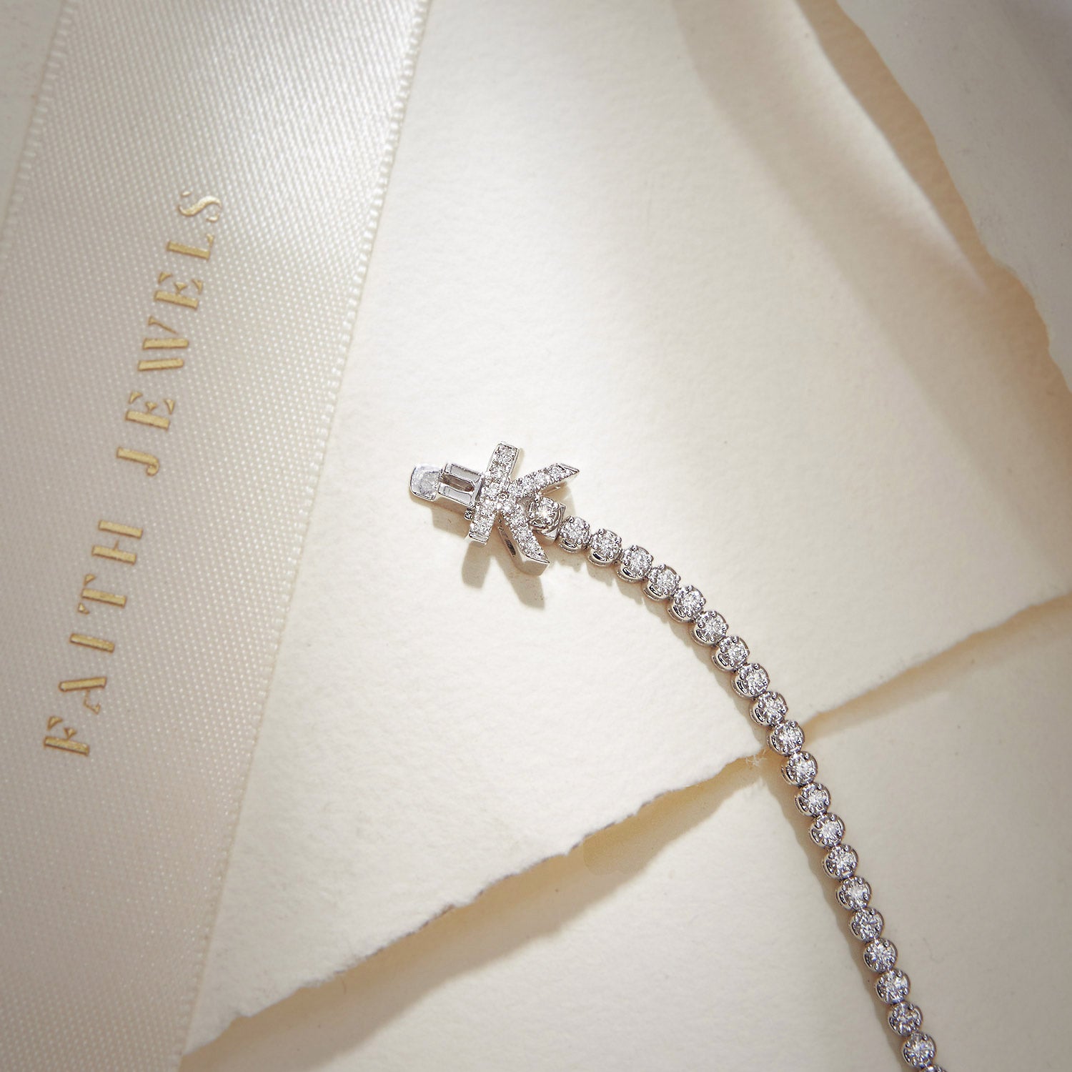 Faith Jewels bespoke initial diamond tennis bracelets in white gold, each featuring a unique clasp shaped as a letter K — set with round brilliant-cut diamond