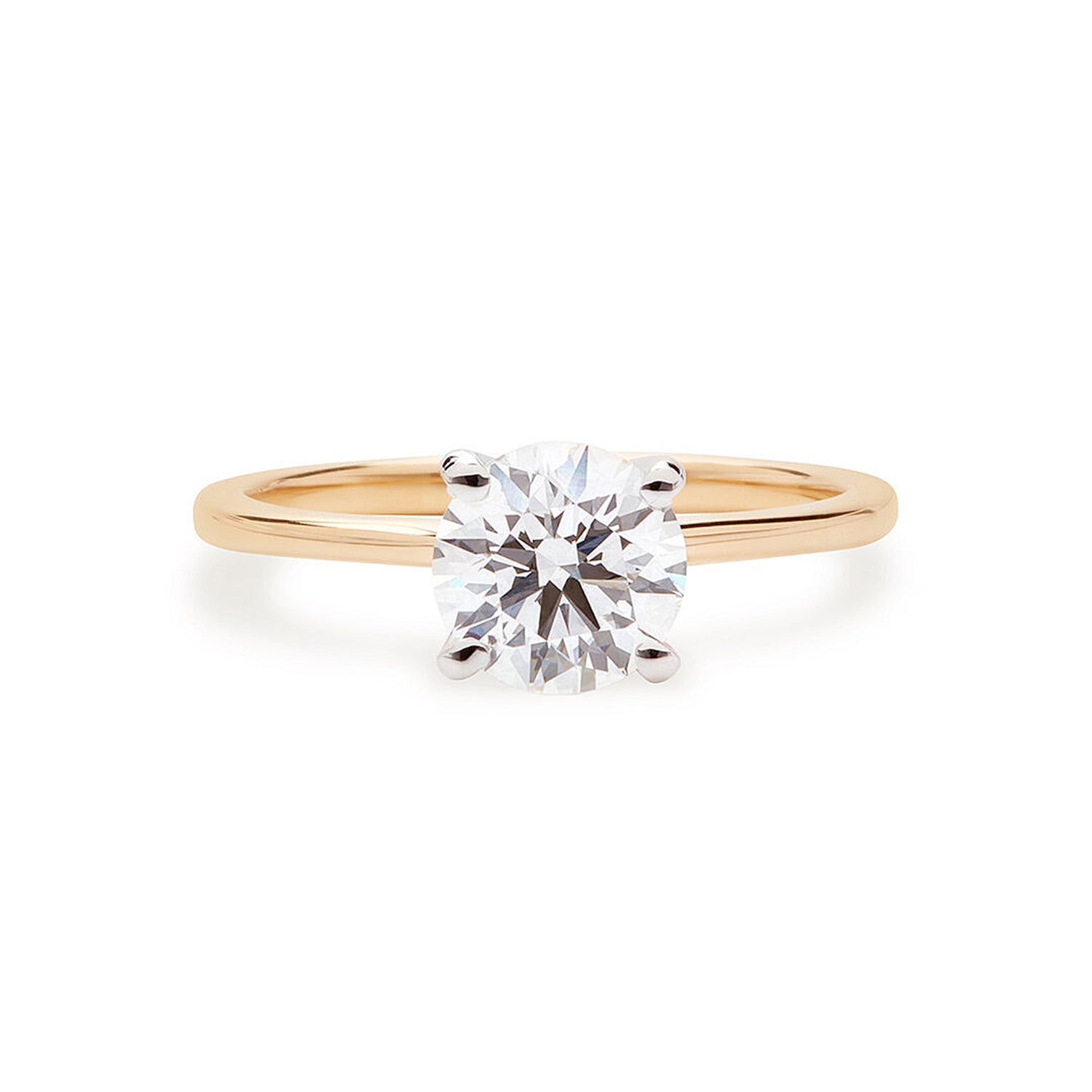 Faith Jewels Jemma diamond engagement ring featuring a classic solitaire design with a tall open four-prong setting and a narrow 18k band to enhance the diamond's brilliance
