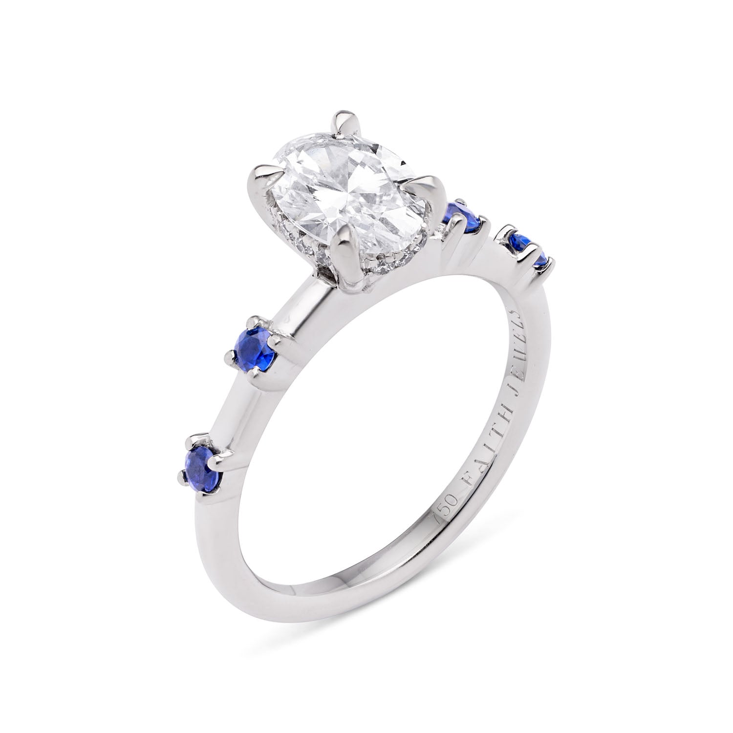Faith Jewels Katherine blue sapphire and diamond engagement ring with a central oval-cut white diamond, accented by four blue Ceylon sapphires on an 18k white gold band