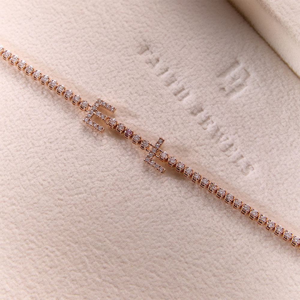 Faith Jewels bespoke initial diamond tennis bracelets in white gold, each featuring initials E and L — set with round brilliant-cut diamond and an argyle pink accent diamond
