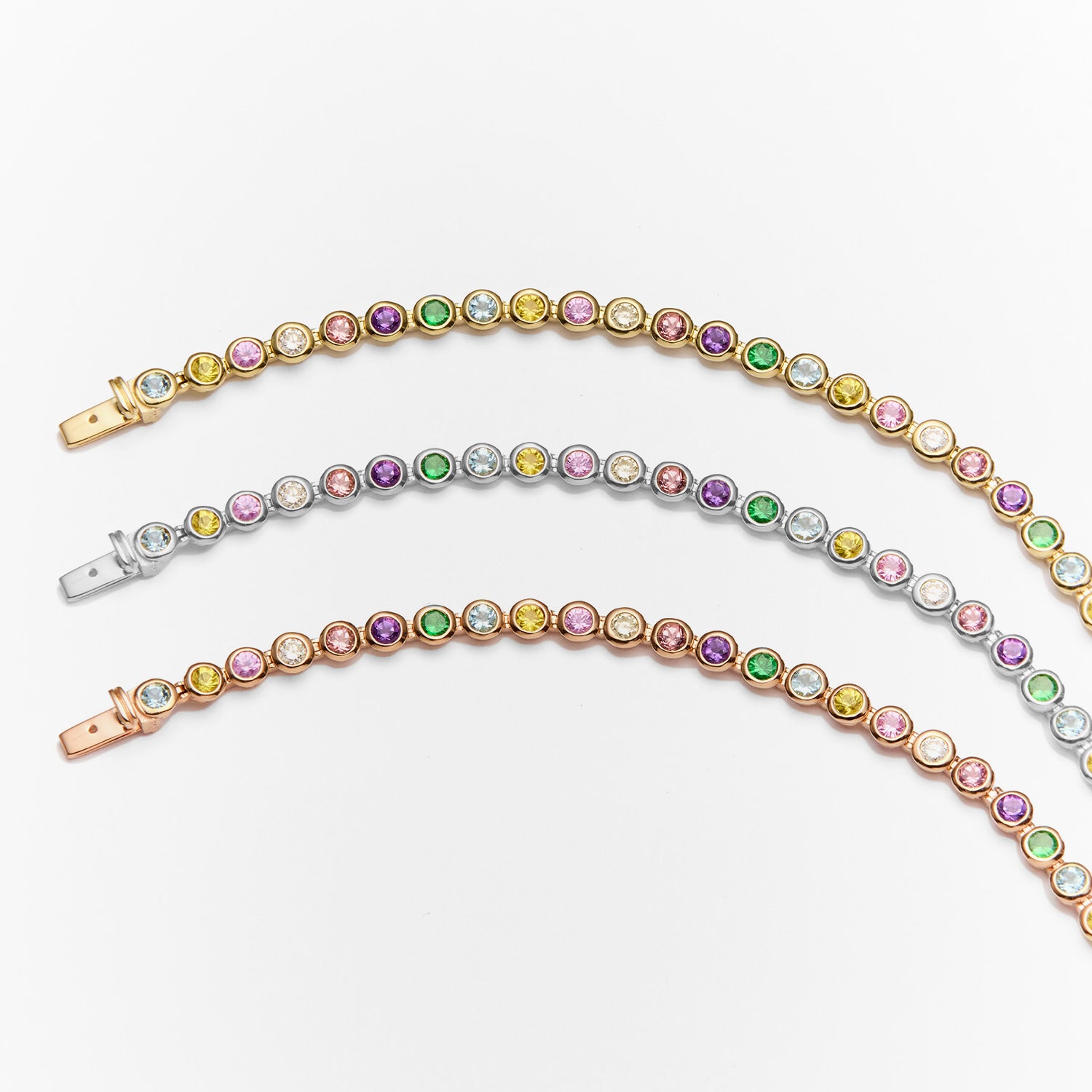 Faith Jewels Rainbow Tennis Bracelet featuring a vibrant mix of aquamarine, sapphires, white diamonds, garnet, peach, and amethyst gemstones totaling 2.80 carats, set in yellow gold, white gold and rose gold chain