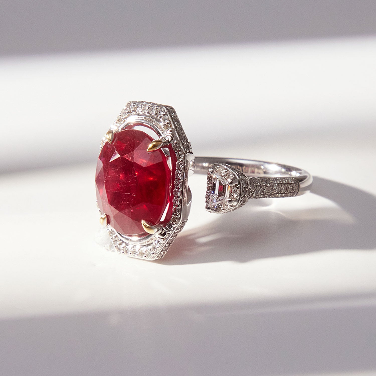 Faith Jewels Toi et Moi ring featuring an 8.50ct ruby and a floating trapezoid white diamond, accented with pavé diamonds in an elegant design