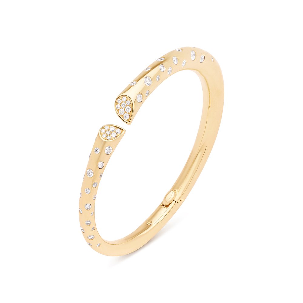 Yellow gold diamond bangle with pavé and hammer-set diamonds, heart-shaped lily motif from Whispers of Love.