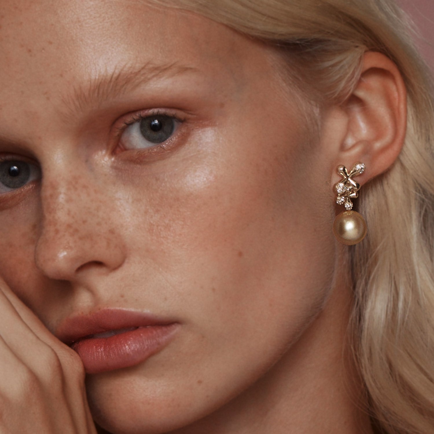 Diamond South Sea Pearl Earrings in 18k yellow gold with 0.92ct diamonds, floral motifs, and golden South Sea pearls, worn on model.