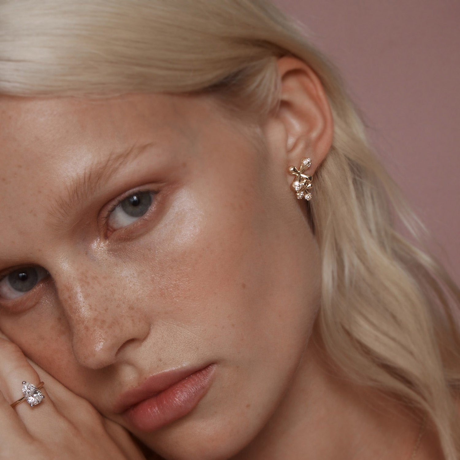 Maxi Diamond Stud Earrings in 18k yellow gold with 24 diamonds totaling 1.00ct and floral motifs, worn on model.