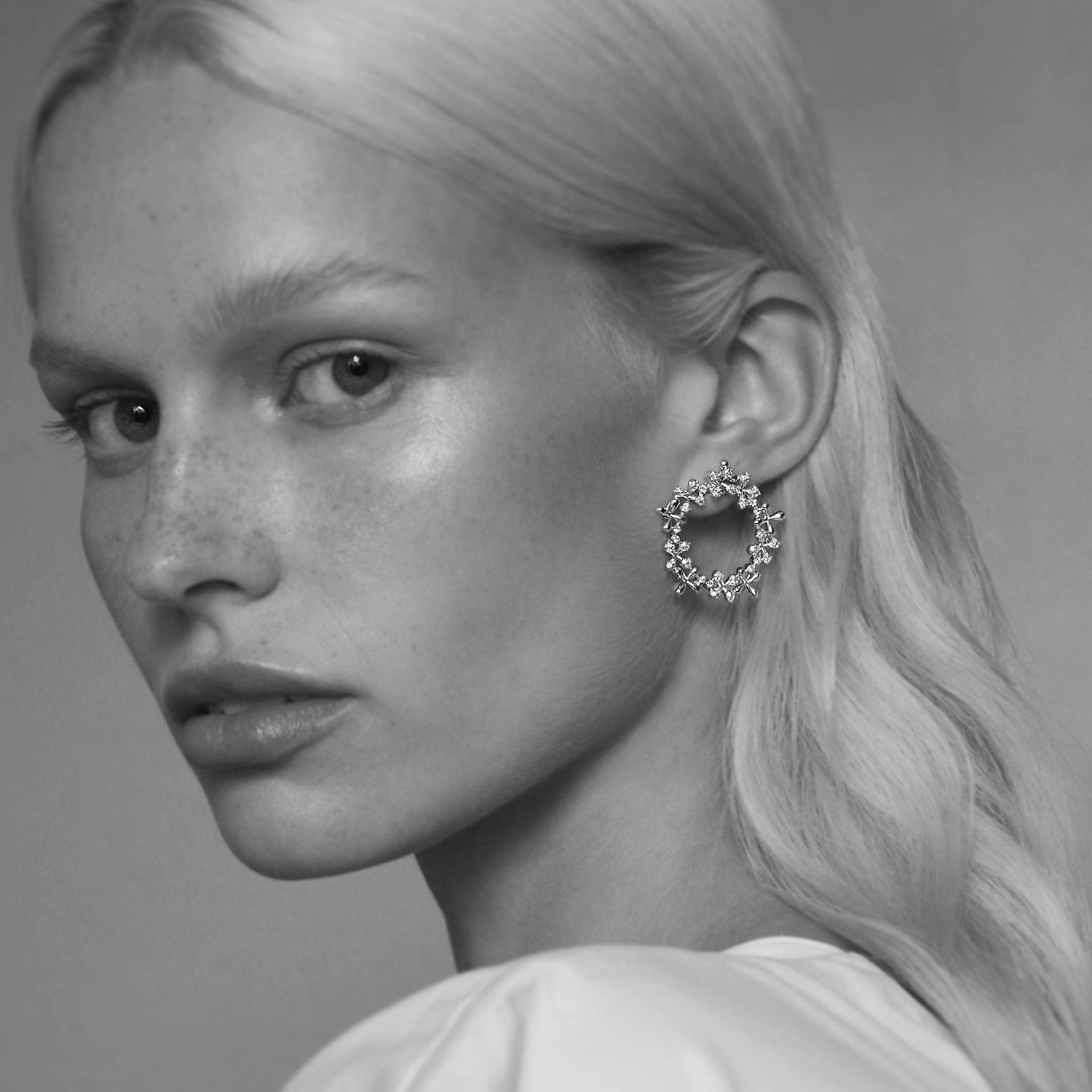 Diamond Wreath Earrings in 18k yellow gold with 1.00ct total diamonds and stylised floral motifs, worn on model.