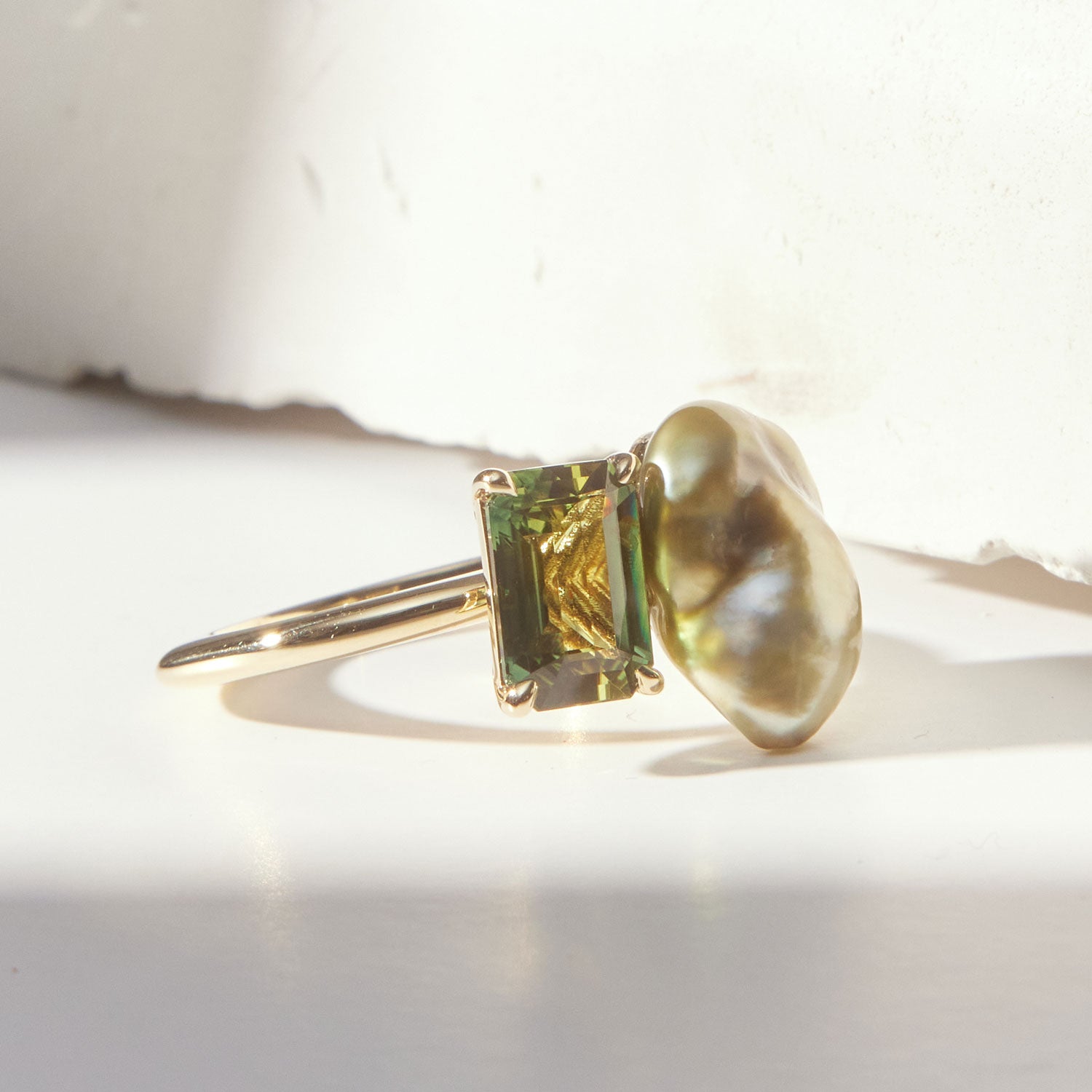 Faith Jewels Toi et Moi ring featuring a baroque pearl and tourmaline set in an 18k yellow gold band