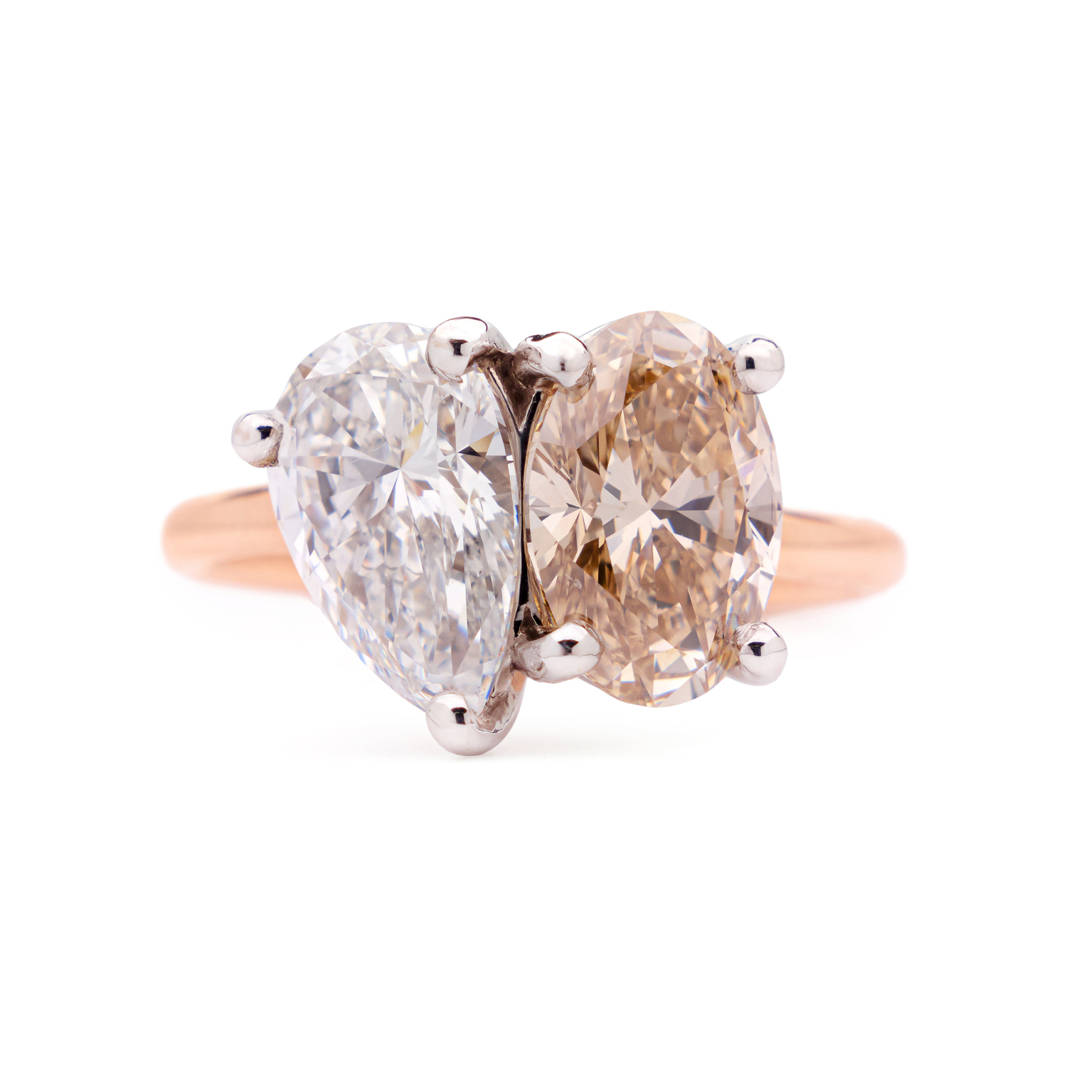 Faith Jewels bespoke ring featuring a champagne oval-cut diamond paired with a pear-cut diamond in a Toi Et Moi design.