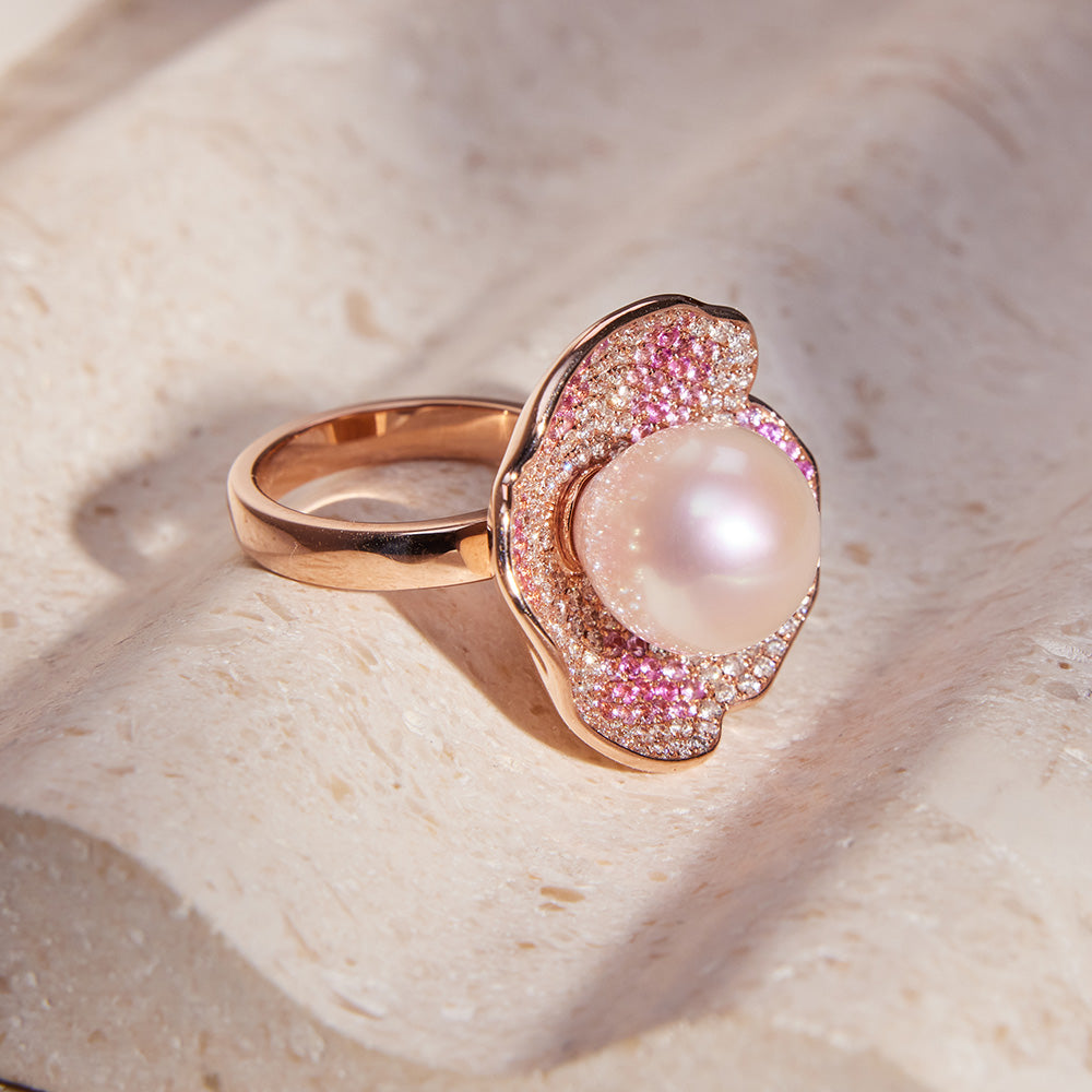 Faith Jewels Rose gold ring and earrings set with a central pearl, pink and white pavé diamonds, and petal-like design.