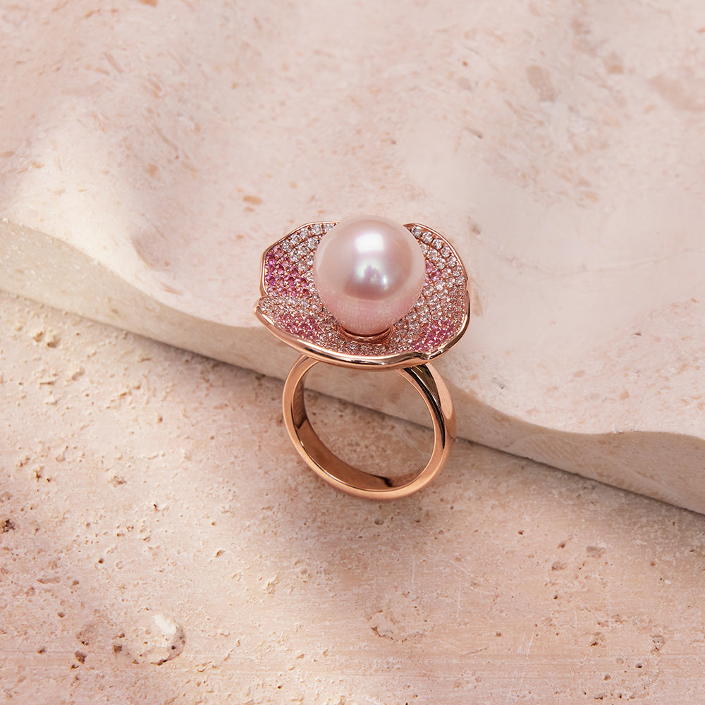Faith Jewels Rose gold ring and earrings set with a central pearl, pink and white pavé diamonds, and petal-like design.