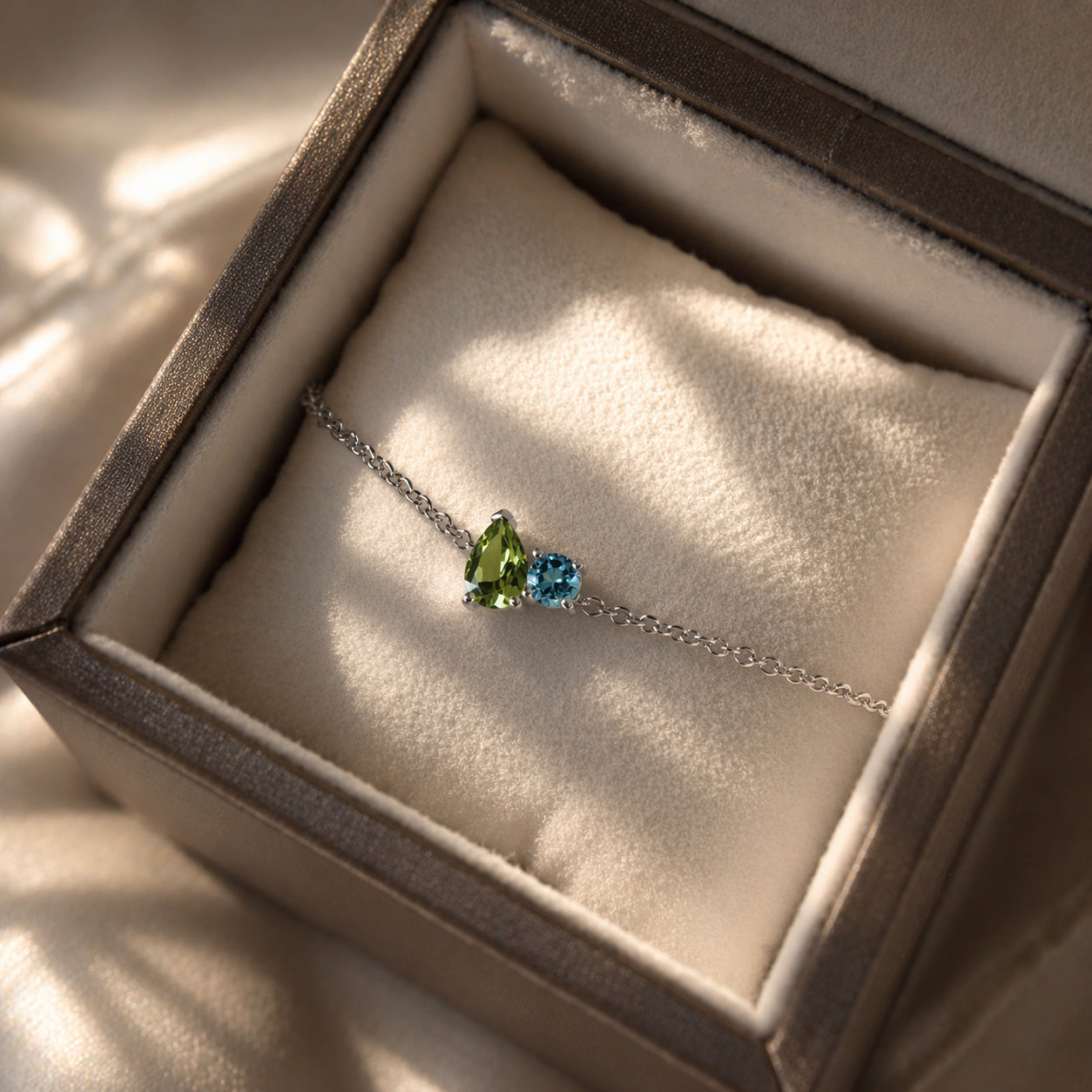 Birthstone bracelet white gold peridot and blue topaz family symbolic fine jewellery minimalist elegant gift bracelet