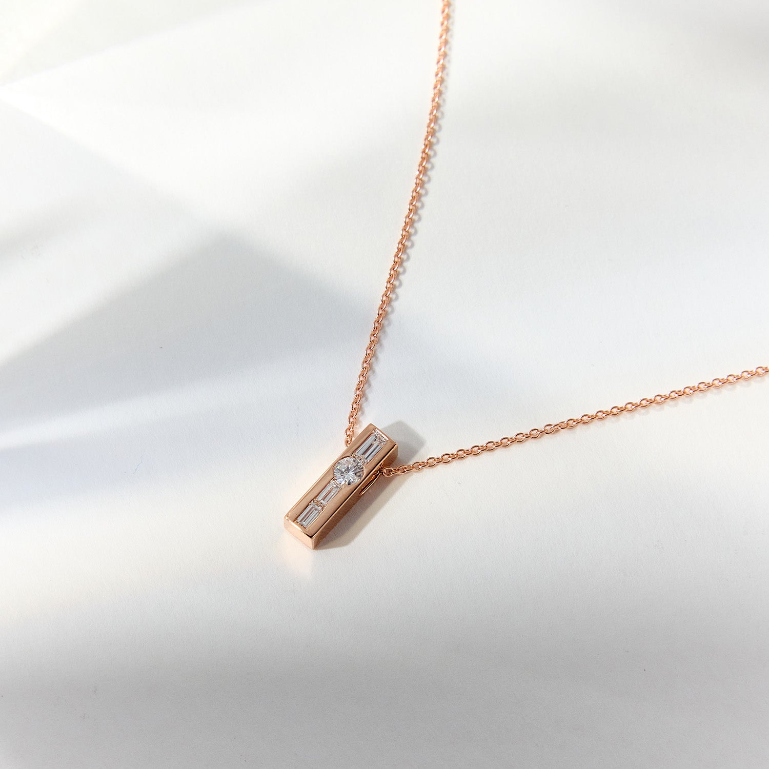 Faith Jewels Rose gold necklace with repurposed diamonds forming the initial "Y" in Morse code.