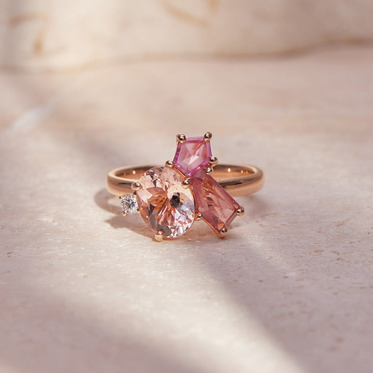 Faith Jewels Rose gold ring with pink morganite, pink spinels, and a white diamond in a floral design
