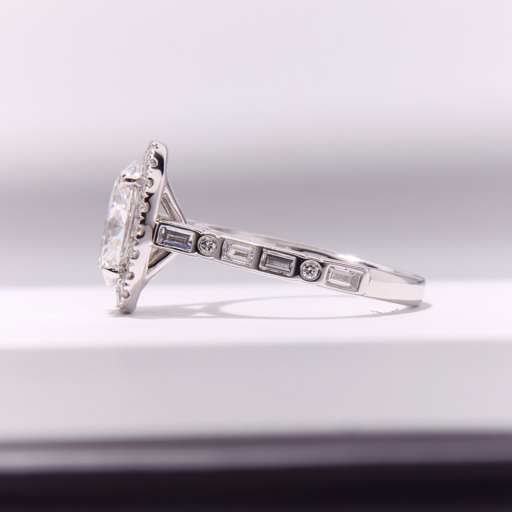 Bespoke Morse Code engagement ring with diamonds spelling initials "Q" and "N", romantic and elegant design.