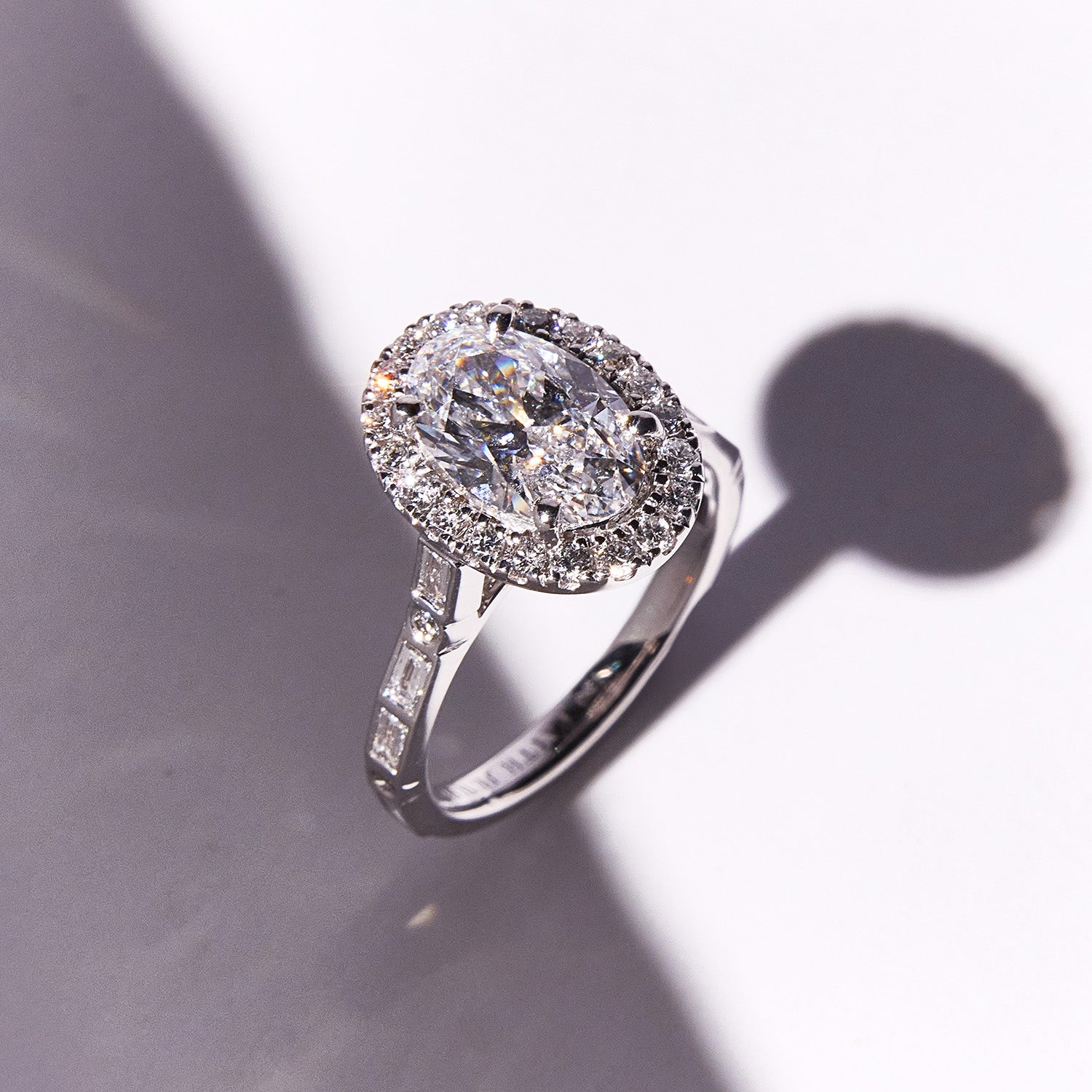 Bespoke Morse Code engagement ring with diamonds spelling initials "Q" and "N", romantic and elegant design.