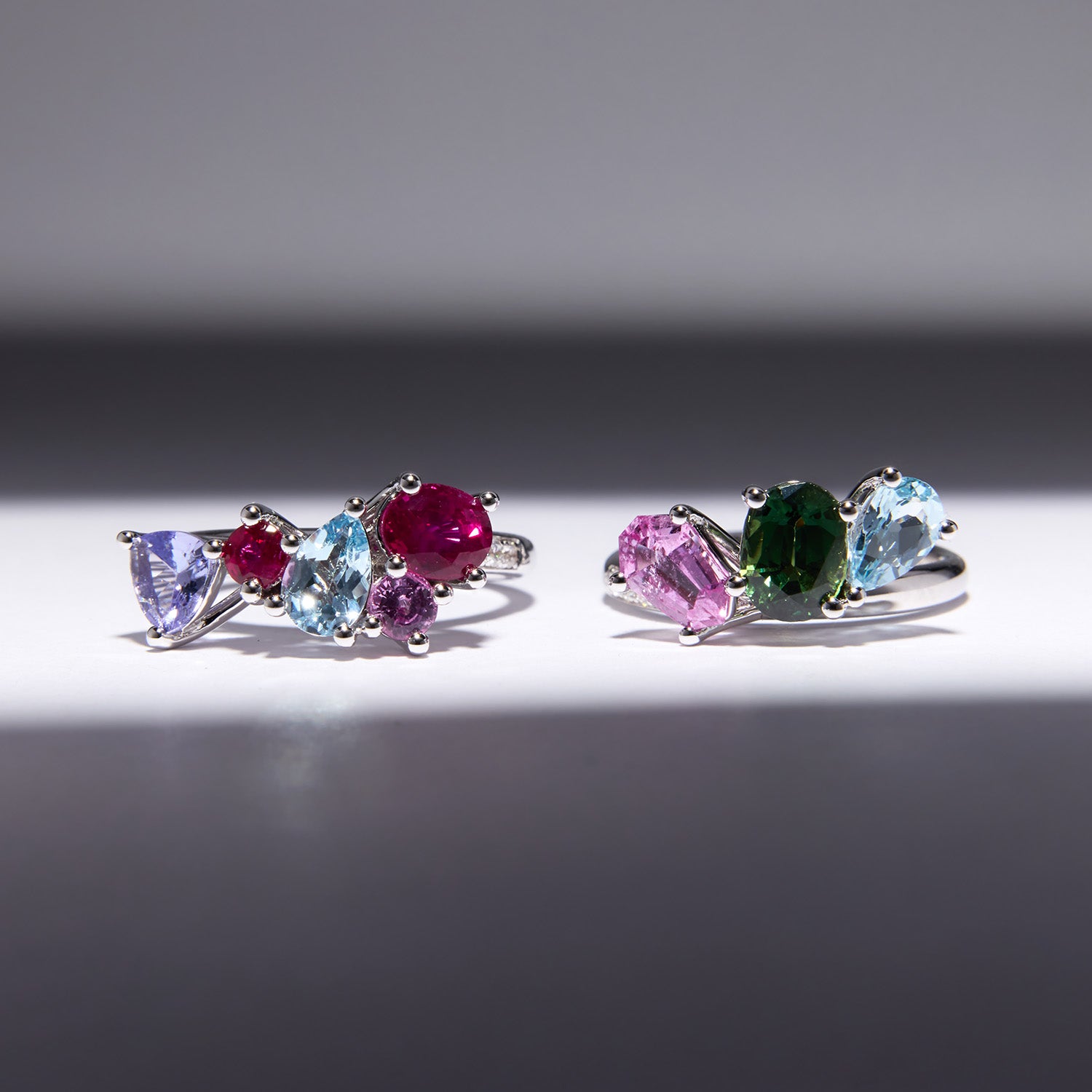 Heirloom Celestial Stack Ring in white gold with sapphires, rubies, tanzanite, topaz, and diamonds, interlocking celestial-inspired design.