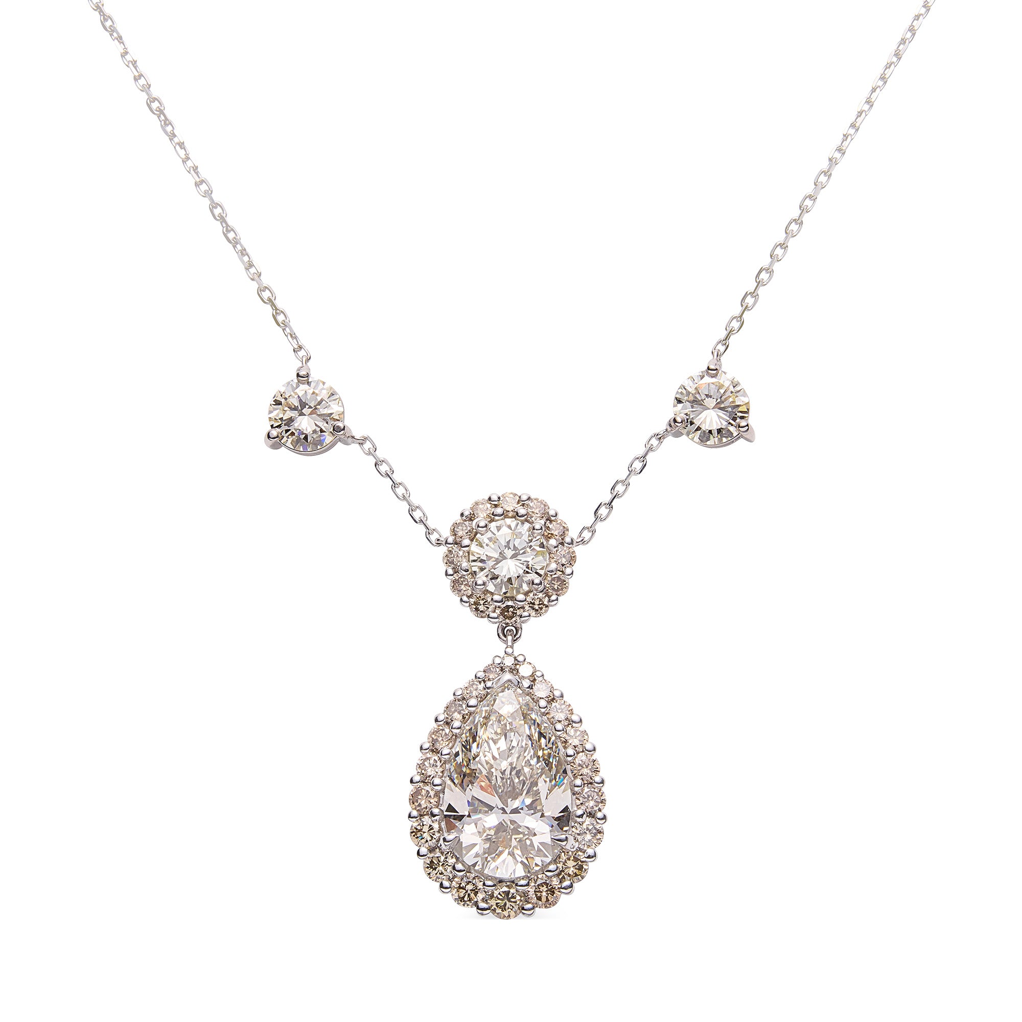 Elegant diamond necklace featuring round brilliant pendant with pear-shaped drop and champagne halo