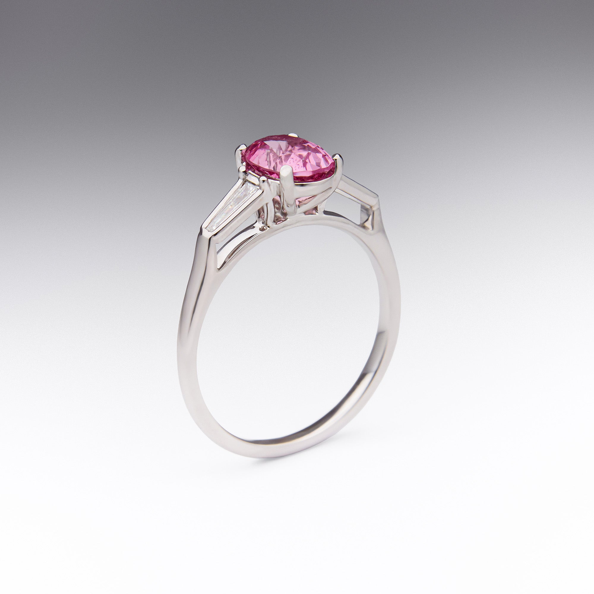 Elegant Pink Spinel Ring with 0.90 carat spinel and tapered baguette diamond accents in 18k white gold