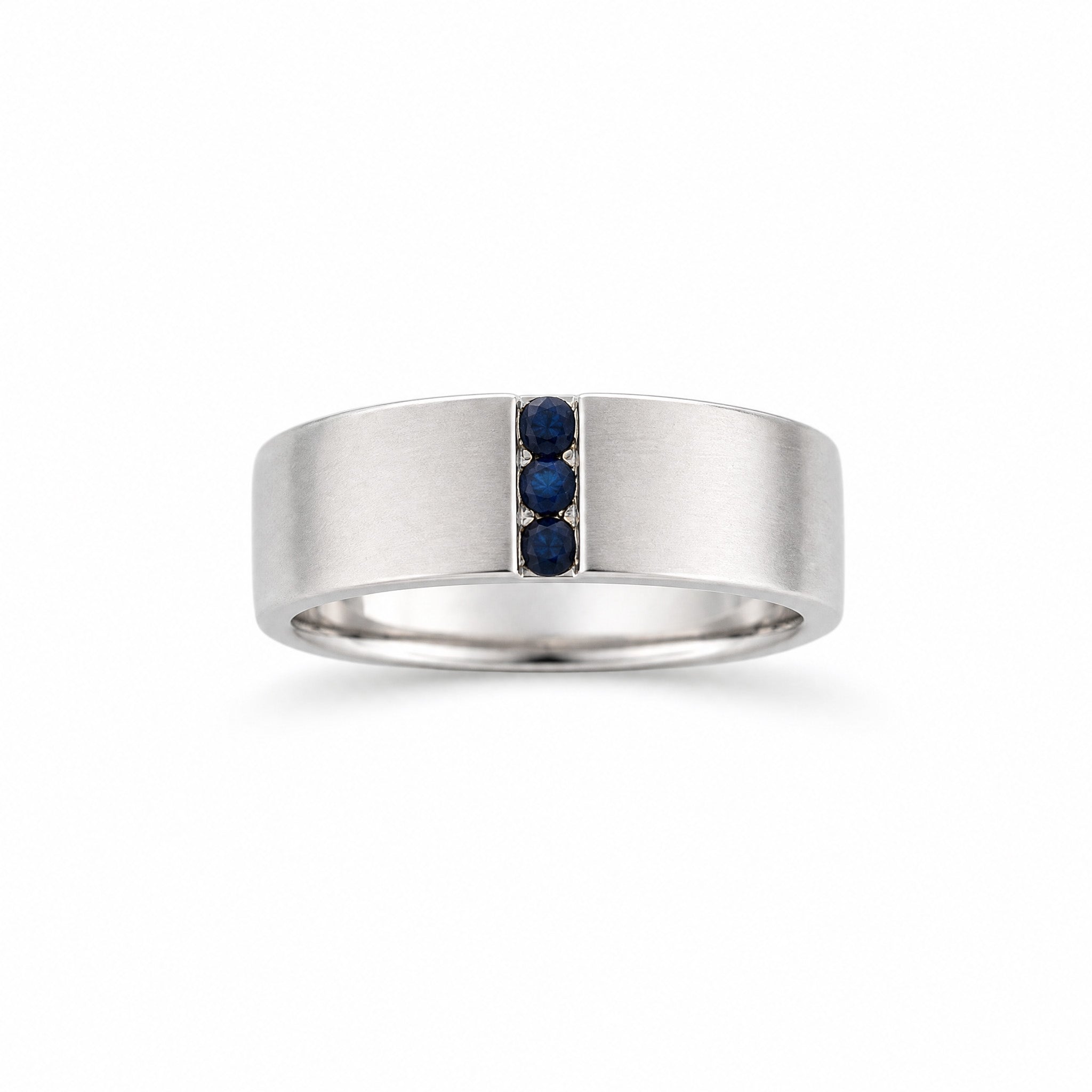 Bespoke blue sapphire gents ring in white gold symbolising love and unity
