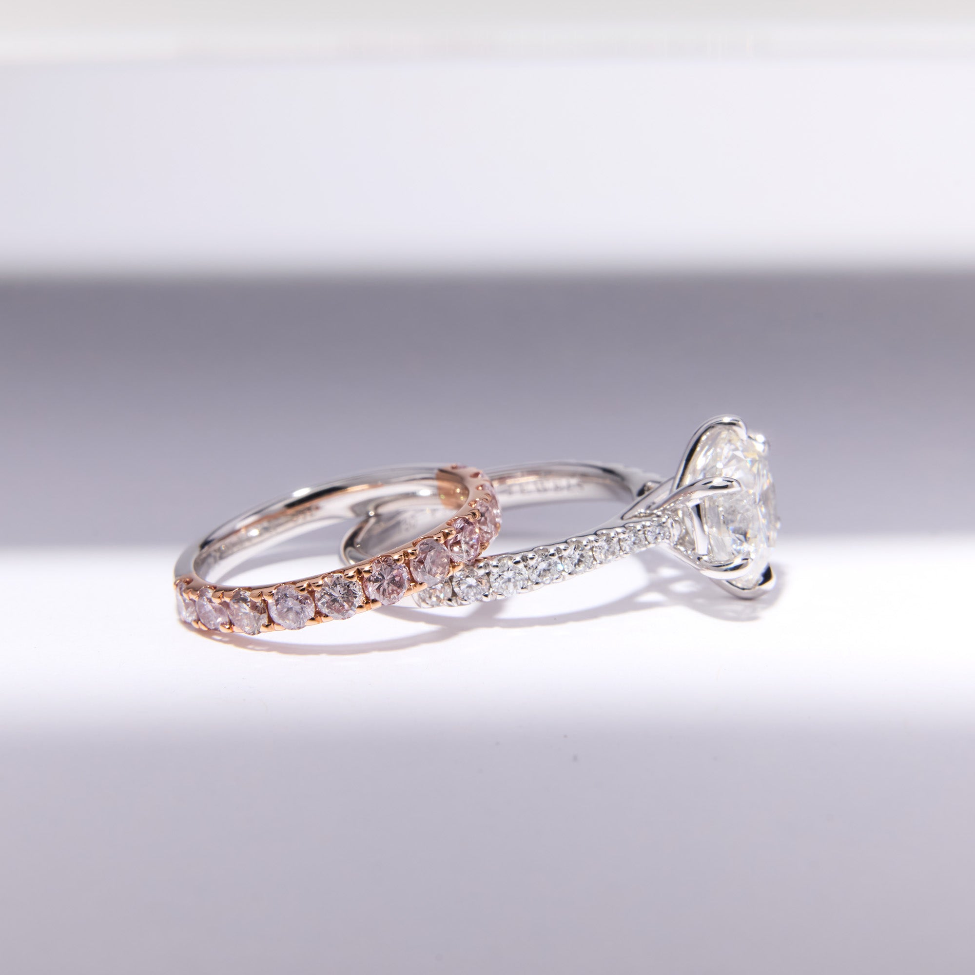 Remodeled engagement and pink diamond wedding ring set with 3ct round diamond, crafted for brilliance, love, and lasting elegance.