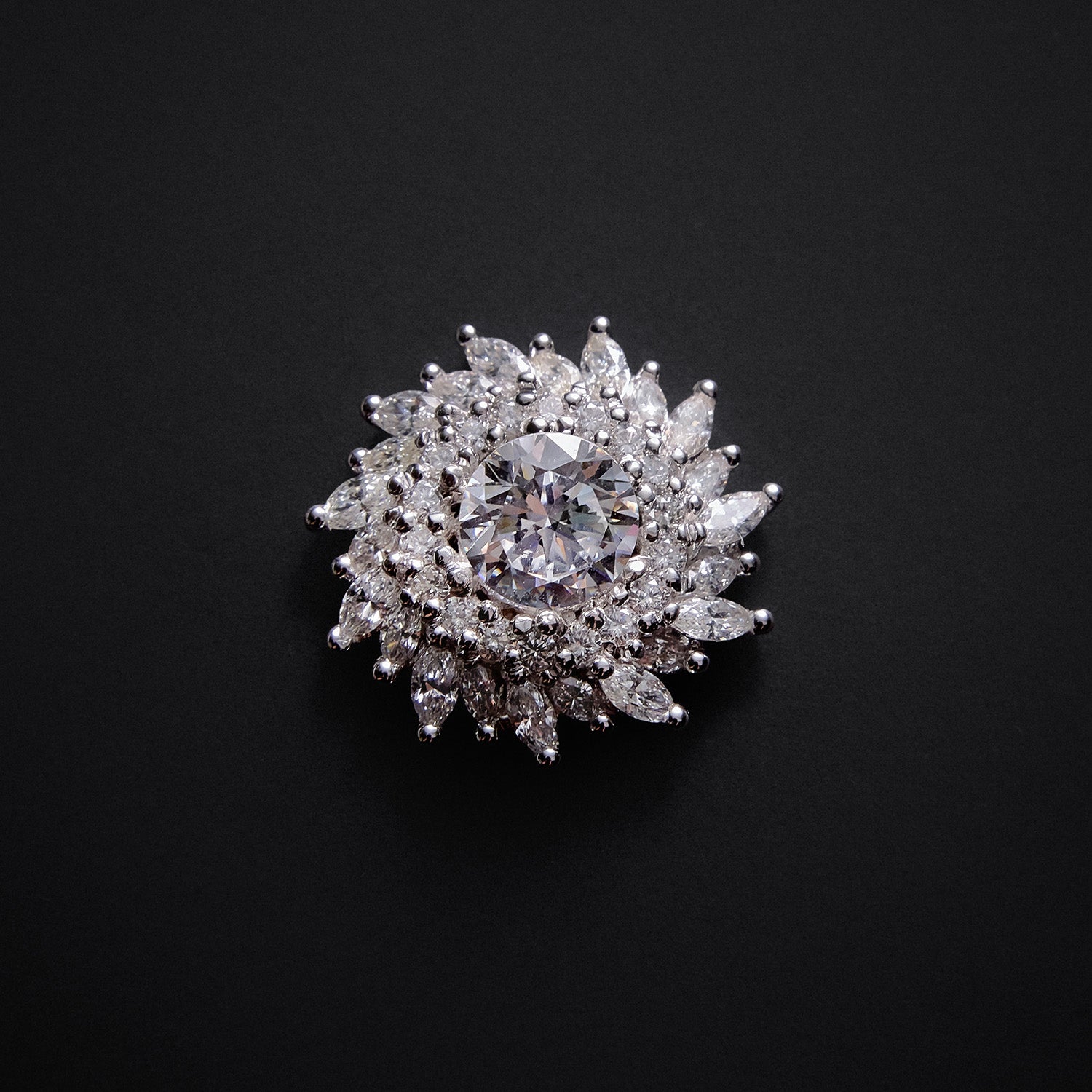 Faith Jewels White gold sunburst halo earring enhancers with round and marquise-cut diamonds, designed to frame diamond studs.