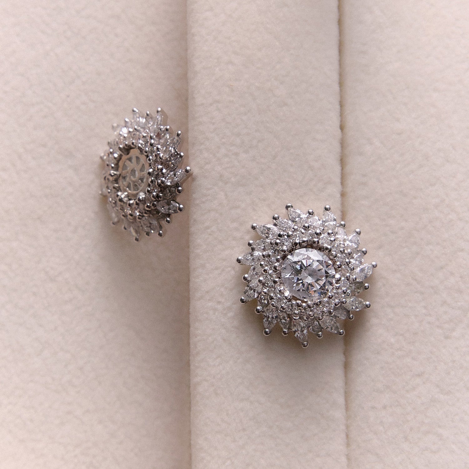 Faith Jewels White gold sunburst halo earring enhancers with round and marquise-cut diamonds, designed to frame diamond studs.