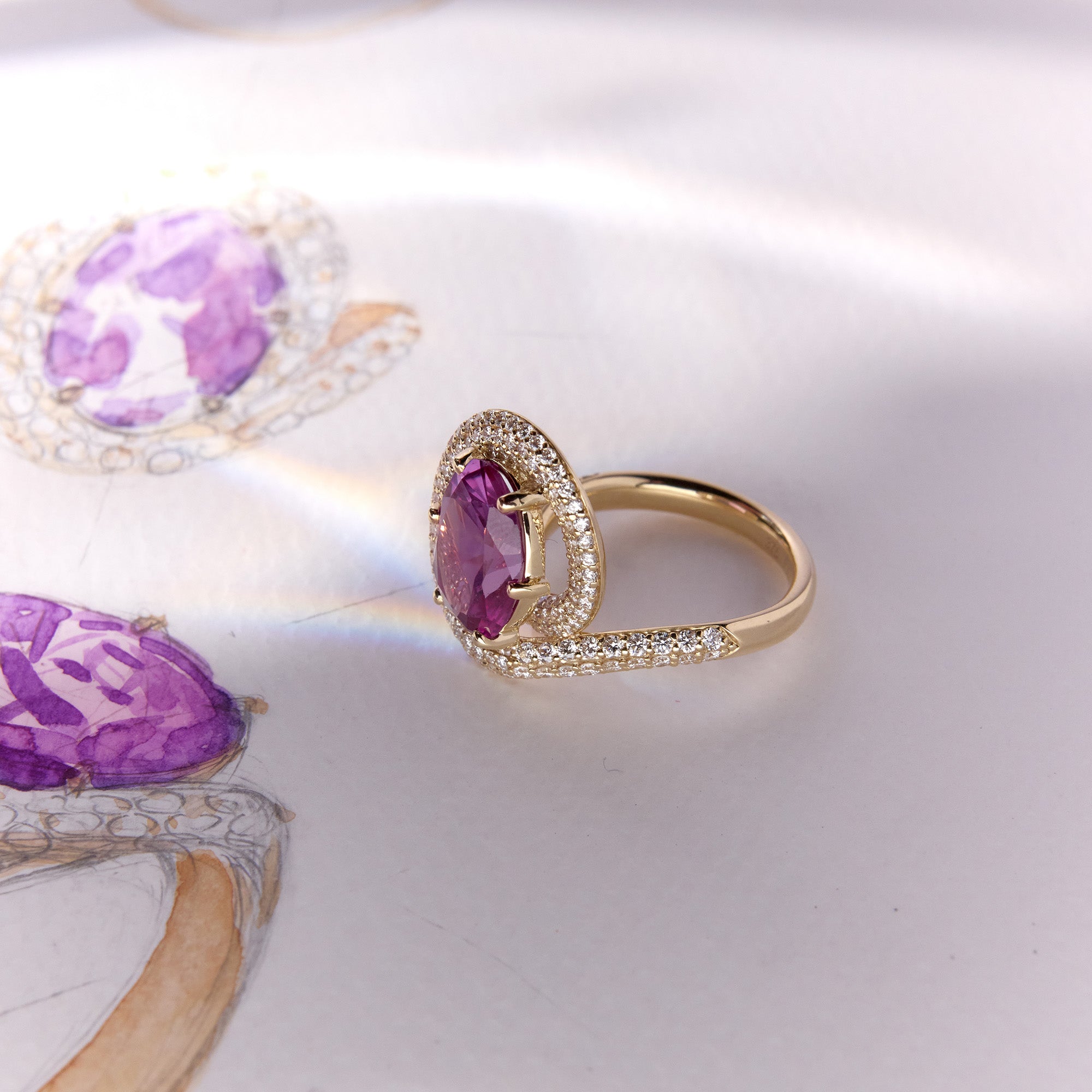 Suzi Ring in yellow gold with heirloom pink-purple gemstone and diamond accents, with hand-drawn sketch