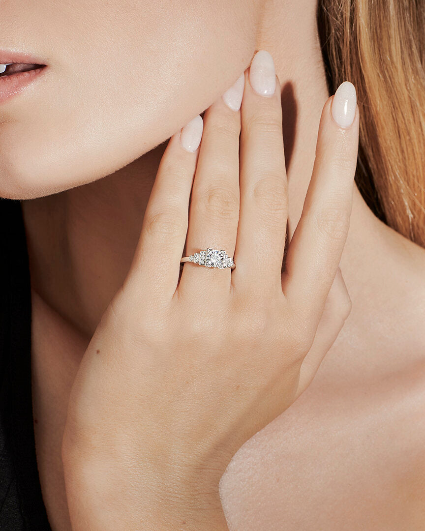 Faith Jewels Empire diamond engagement ring featuring a Princess cut center diamond, flanked by Brilliant cut diamond steps, inspired by Art Deco and the Empire State Building