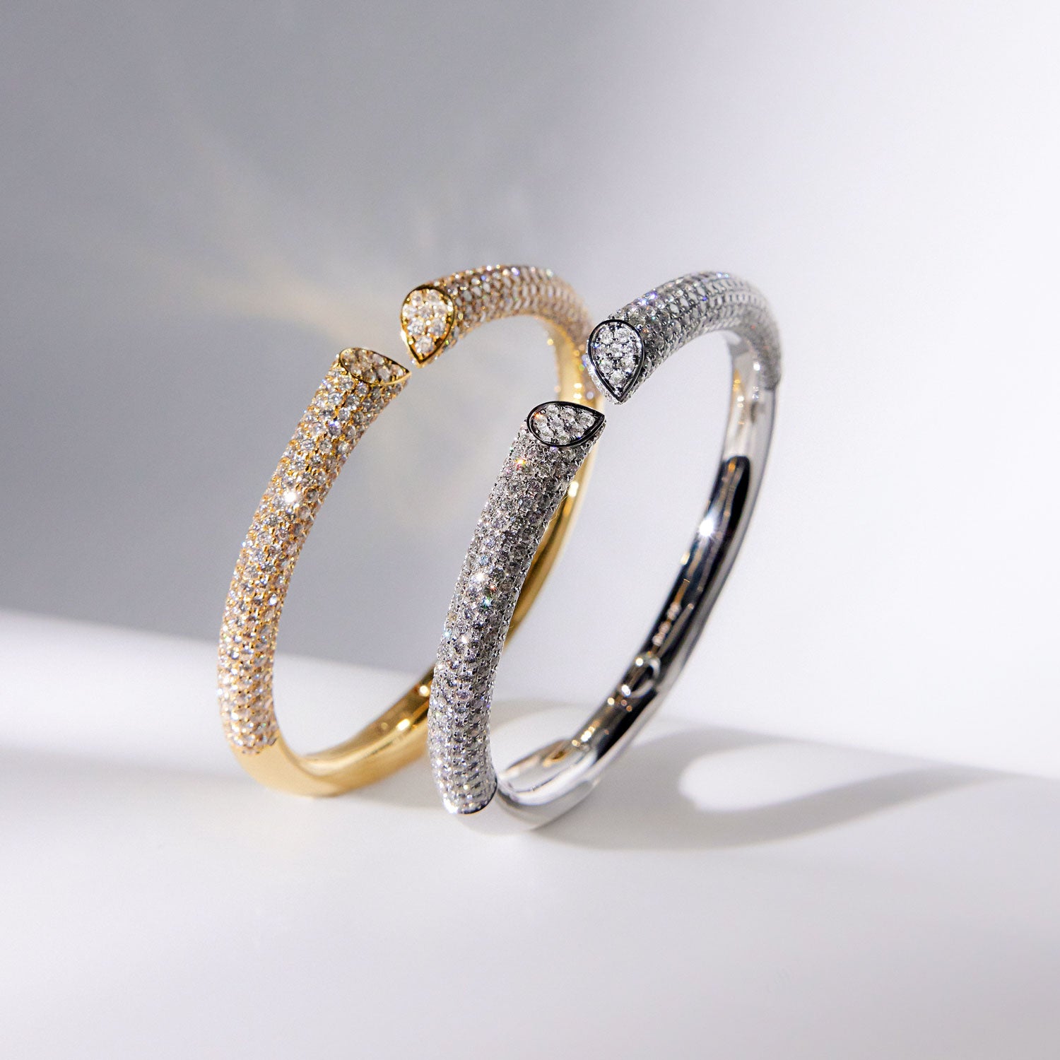 Faith Jewels 18k yellow and white gold bangle with 6.00ct pavé diamonds, featuring a heart-shaped lily petal design and secure hinge closure