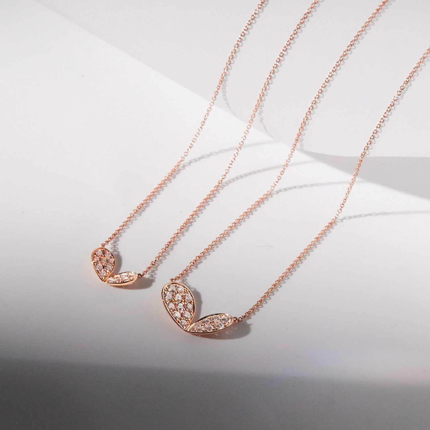 Faith Jewels 18k rose gold necklace with a pavé diamond lily petal motif, adjustable chain length of 45cm or 42cm, in two different sizes