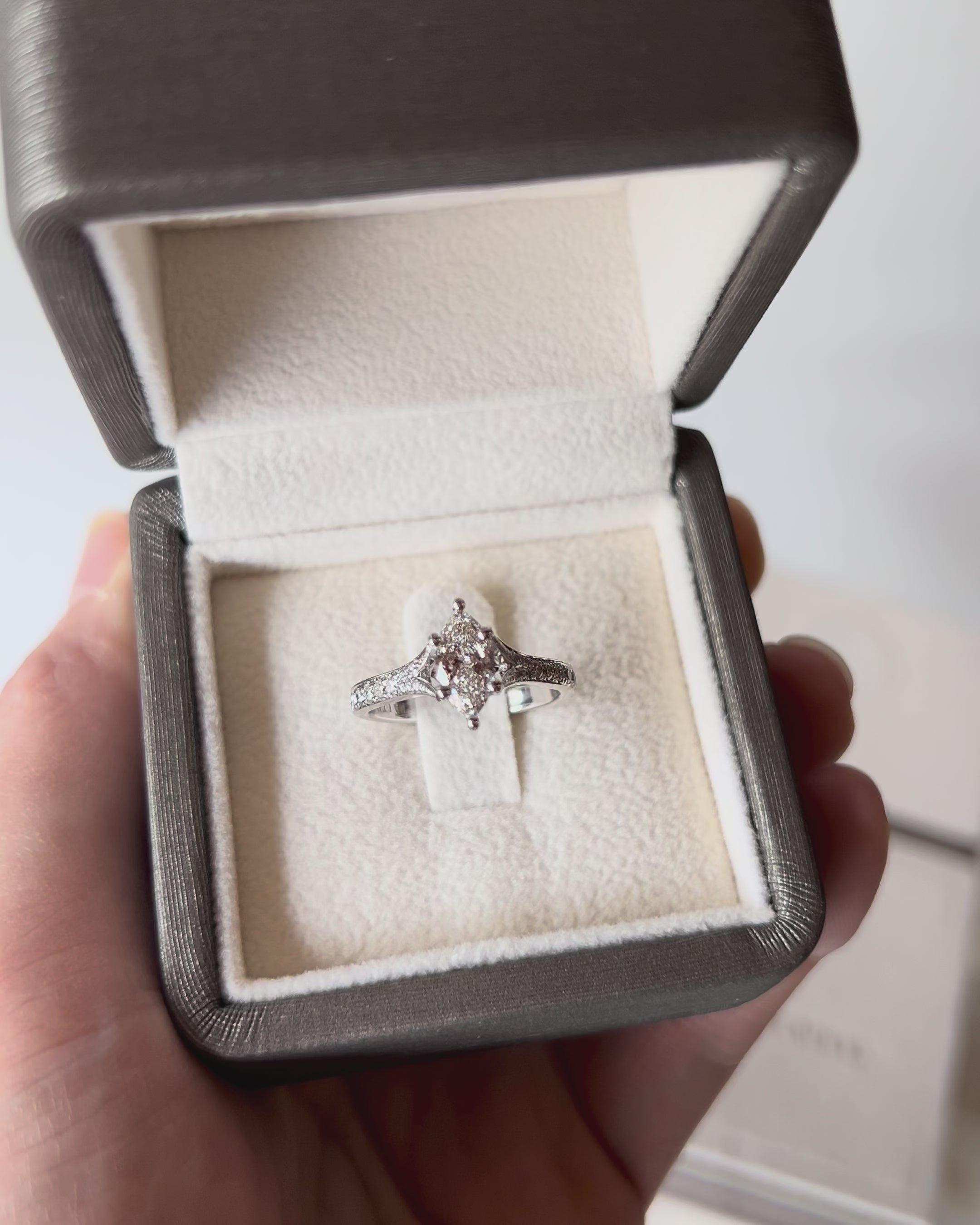 Elegant Marquise Split Band Diamond Ring in white gold, featuring centre marquise diamond and sparkling shoulder accents.