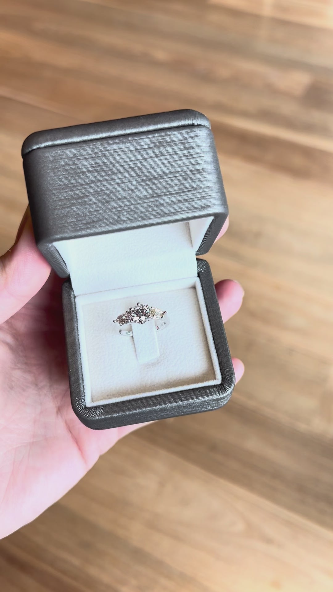 18k white gold Trilogy Engagement Ring featuring radiant round centre diamond and pear-cut pink & yellow side stones, timeless and modern.