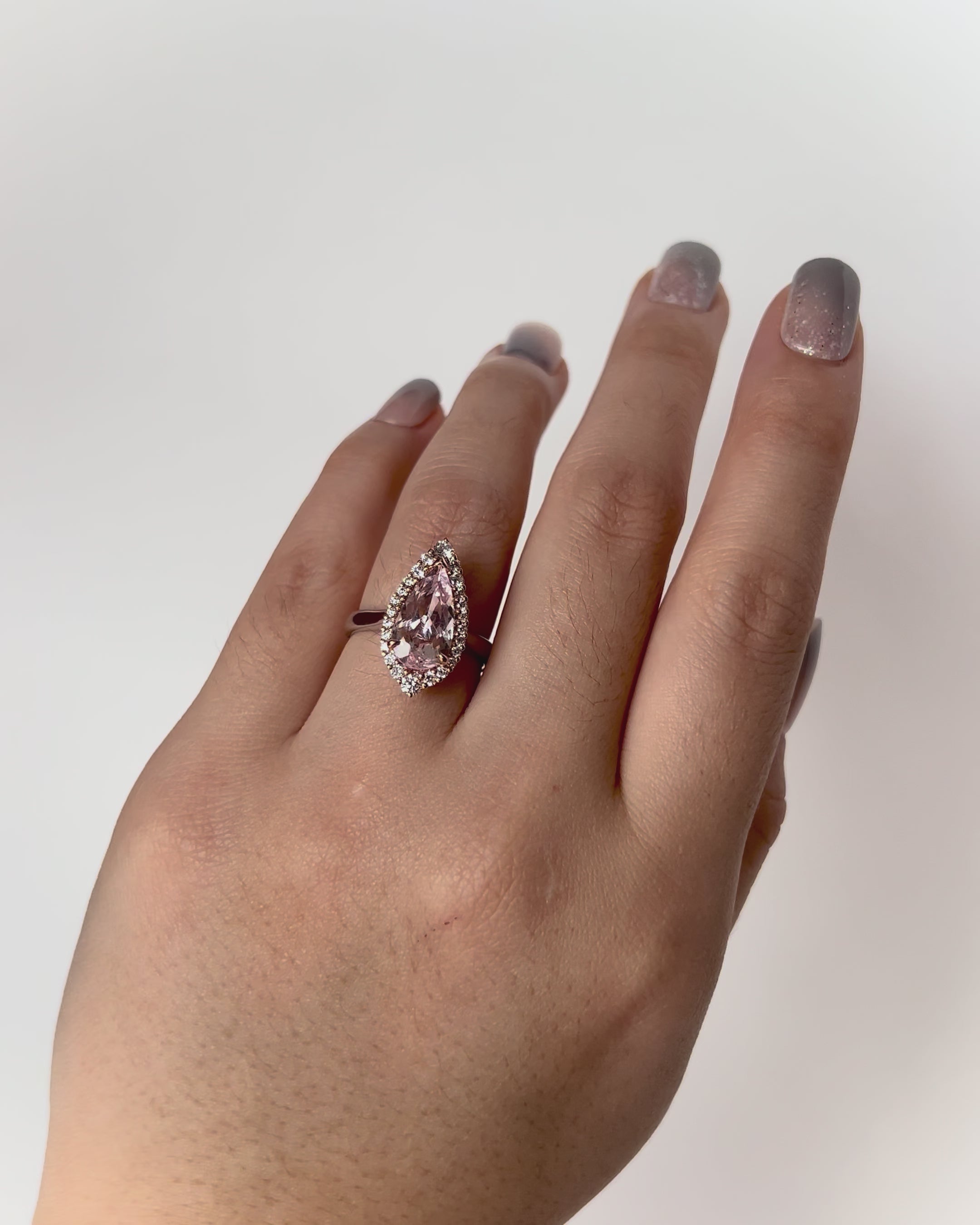 One of a Kind Adeline Morganite Engagement Ring featuring pear-cut pink morganite, round diamond halo, set in 18k rose and white gold.