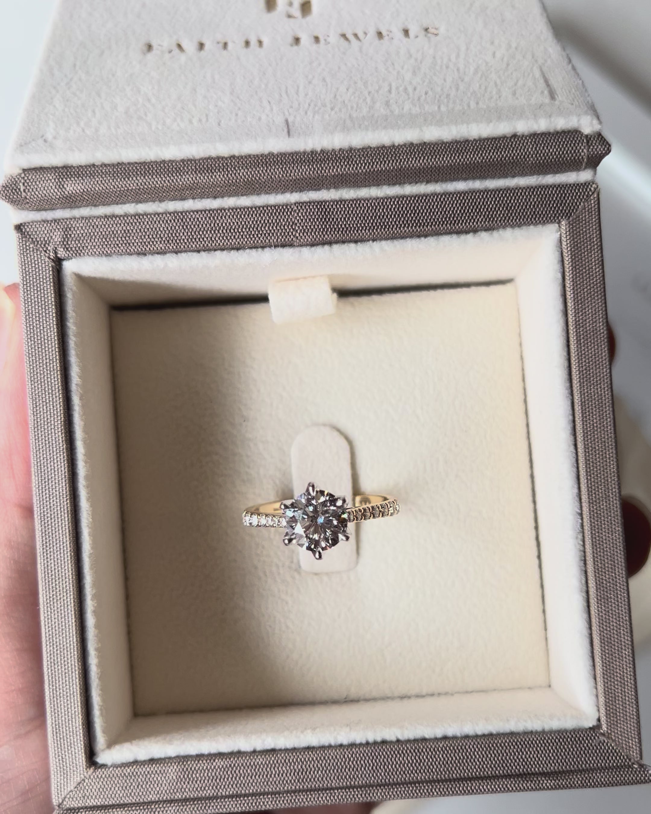 Yellow gold Clarissa solitaire engagement ring with 1.51ct diamond, pavé band, and Faith Hilda’s signature petal claw design.