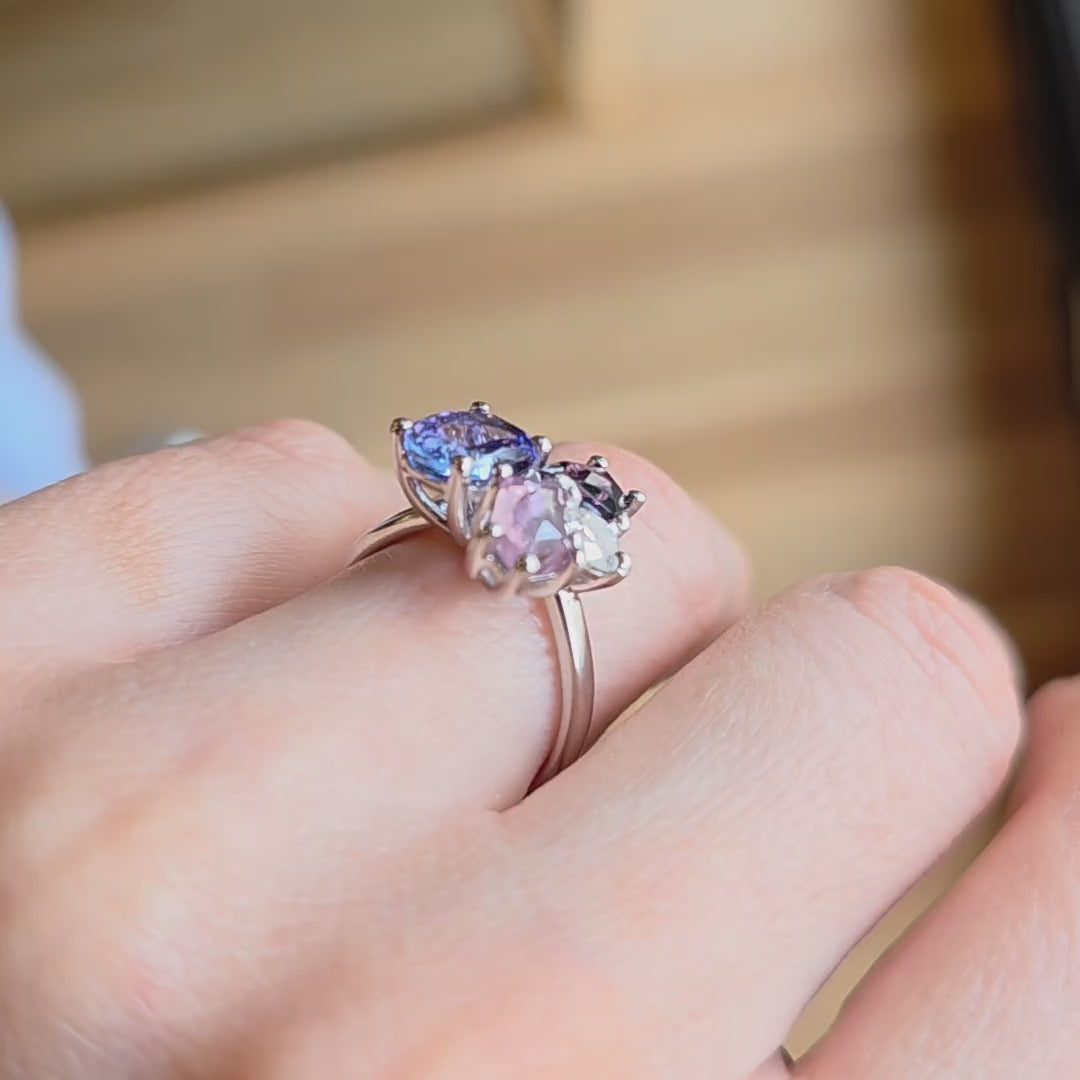 White gold ring from the Faith Jewels Bouquet Series featuring tanzanite, blush spinel, purple spinel, and an heirloom diamond